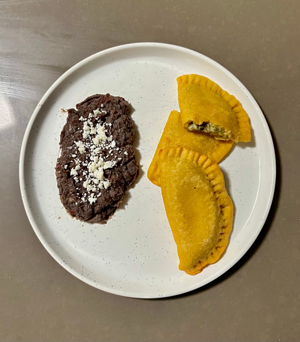 Week 3: Oaxacan. Molotes filled with mushroom and rajas. Refried black beans on the side.
